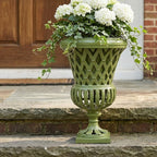Lattice Garden Urn planted with ivy and white hydrangeas on a front doorstep