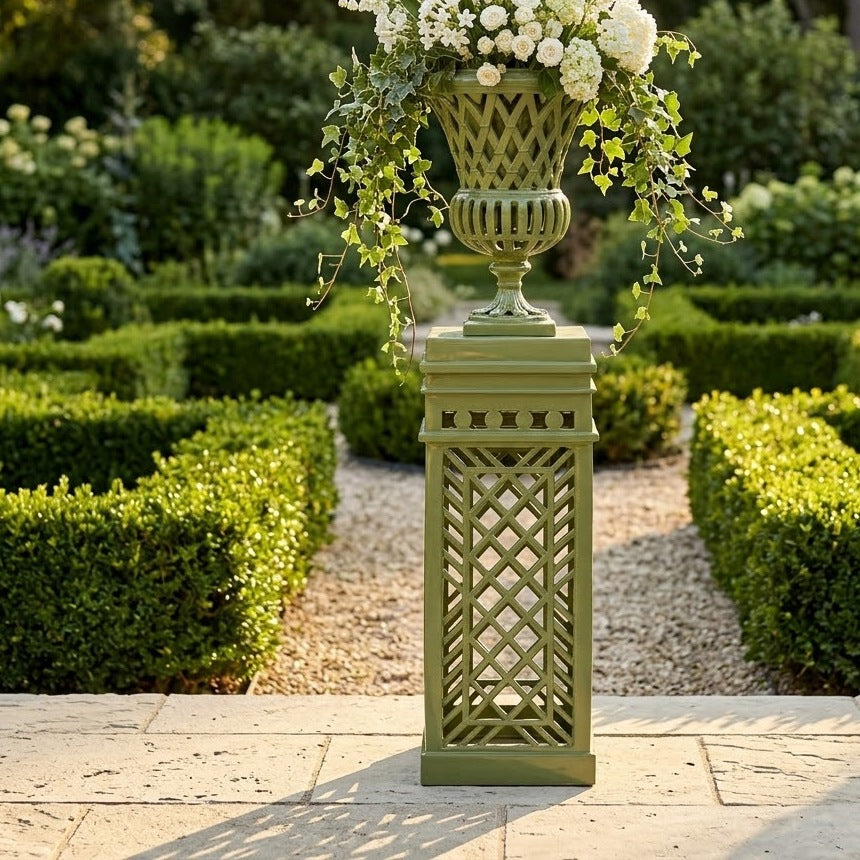 Lattice Garden Urn on matching pedestal in a formal boxwood garden